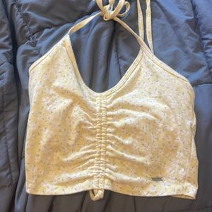Small yellow flowered cropped halter top.